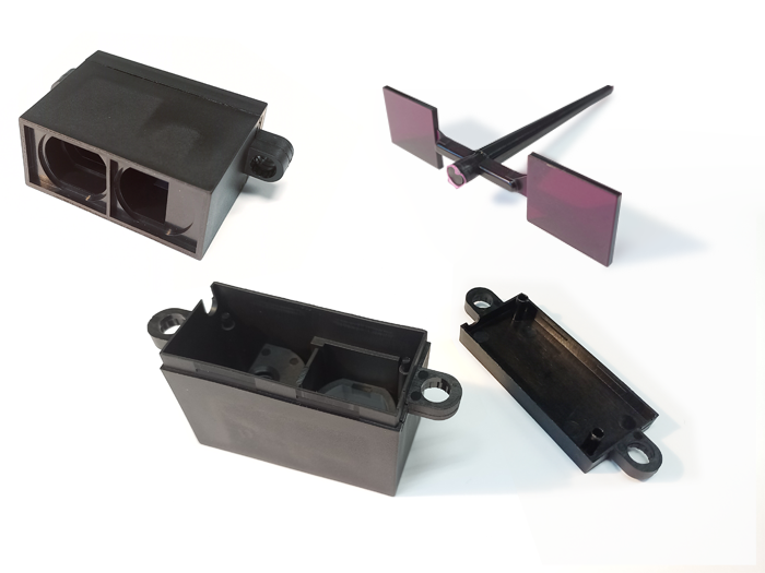 Contenitore per sensore di controllo per porte girevoli con lente trasparente filtrante di colore viola